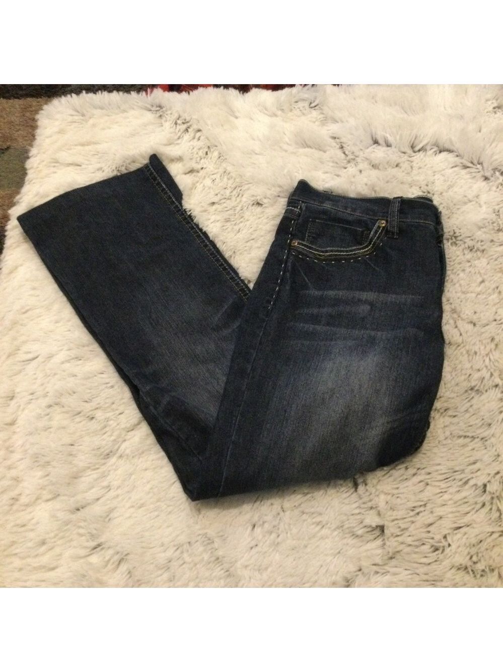 TJC Woman’s size 12 jeans dark wash 5 pocket button zipper closure